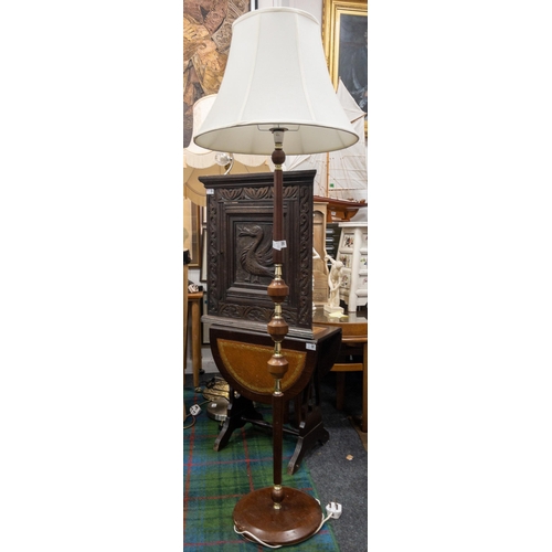 286 - A large floor lamp in wood with brass fittings and a cream shade. 155cm high approx.#296