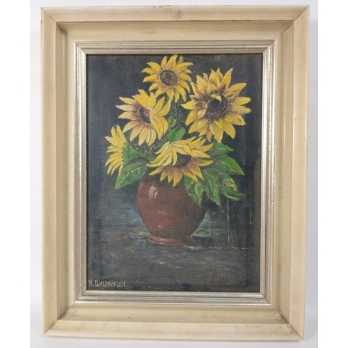 305 - An oil on canvas painting of sunflowers signed by M UHLENBRUCH, frame size 50x40cm, visible work 38x... 