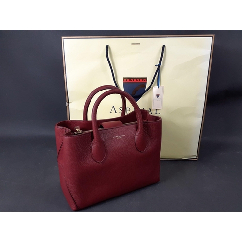 328 - A bordeaux pebble tote mini handbag stamped ASPINAL of LONDON with 2 interior compartments plus 2 zi... 