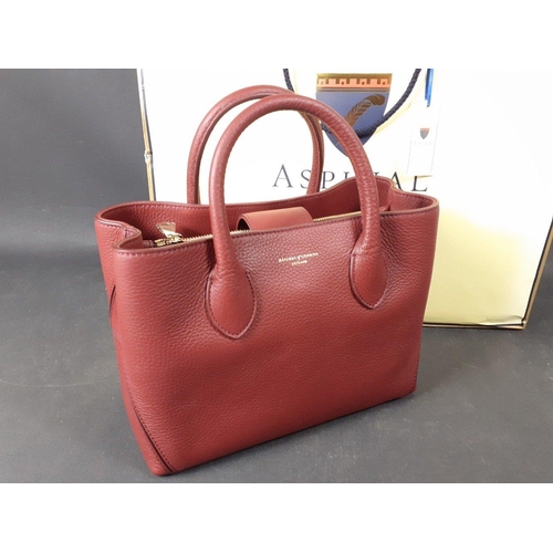 328 - A bordeaux pebble tote mini handbag stamped ASPINAL of LONDON with 2 interior compartments plus 2 zi... 