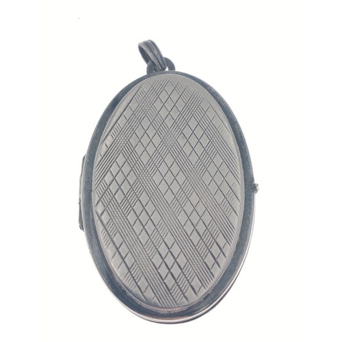 35 - A STERLING SILVER stamped over-sized oval locket pendant - dimensions height 4.5cm x width 3cm and w... 