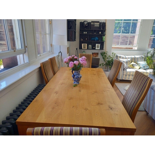 362 - A substantial  light Oak dining table by ROYAL OAK and six matching oak dining chairs in striped fab... 