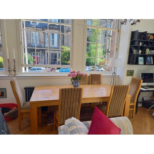 362 - A substantial  light Oak dining table by ROYAL OAK and six matching oak dining chairs in striped fab... 