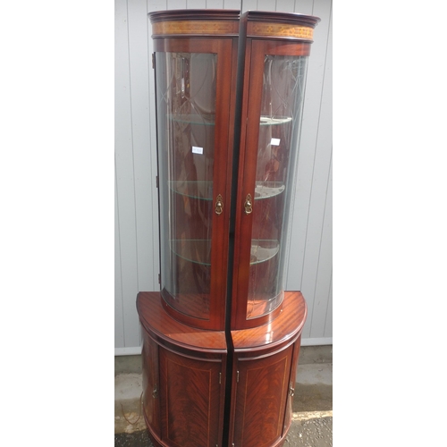 378 - A pair of dark wood glazed corner display cabinets with two cupboard doors / / height 195cm x width ... 