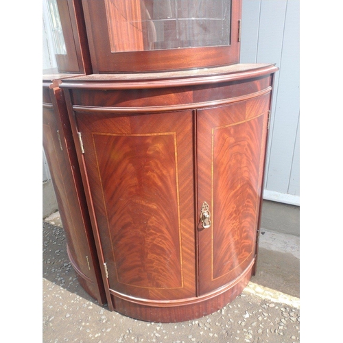 378 - A pair of dark wood glazed corner display cabinets with two cupboard doors / / height 195cm x width ... 