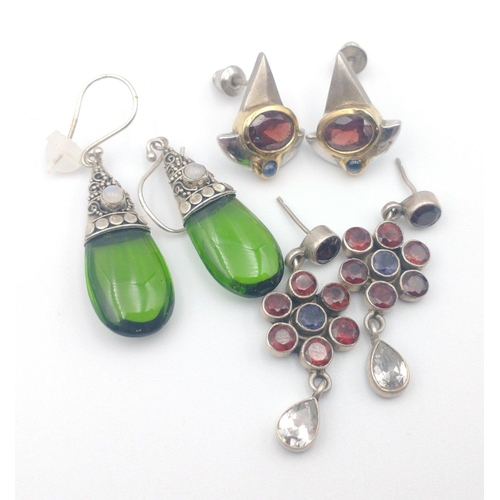 39 - Three pairs of 925 stamped silver earrings, two pairs with coloured red stones with studs, the last ... 