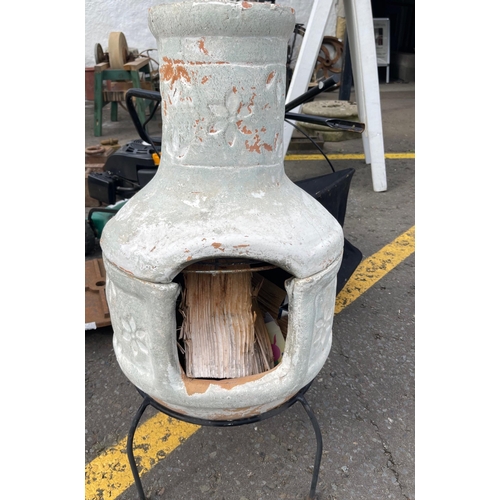 392 - A nice two piece pottery CHIMNEA on a wire work stand - height 83cm x 38cm diameter approx - complet... 