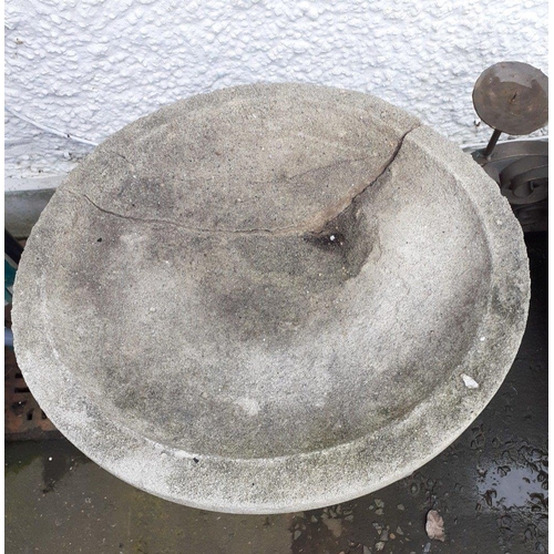 393 - A very old two piece bird bath consisting of a small boy holding up the bath which has been repaired... 