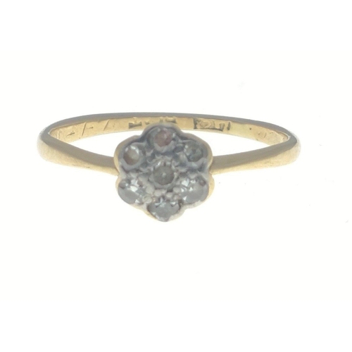 4 - An indistinct stamped yellow metal (looks like 9ct) and floral diamond(tested)set VINTAGE ring with ... 