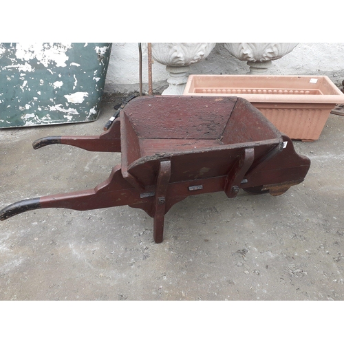 404 - A very attractive model wheel barrow with metal wheel.  Very rustic construction but displays superb... 