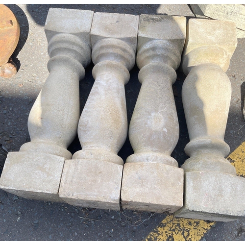 405 - A set of four stone effect  balustrade masonry - would make an effective garden feature#421