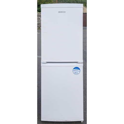 425 - A BEKO A CLASS frost free fridge freezer - this item requires cleaning inside - dimensions 150cm hei... 