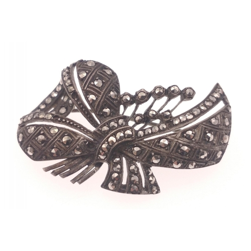 43 - A VINTAGE Marcasite studded brooch in bow form weight 10.05g gross approx dimension 4cm across appro... 