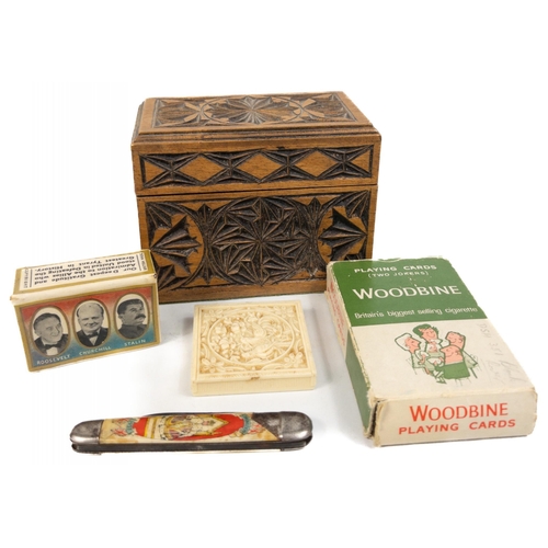 438 - A carved wooden box (11x7x9cm) with 2 packs of playing cards, a pack of WOODBINE playing cards, a MA... 