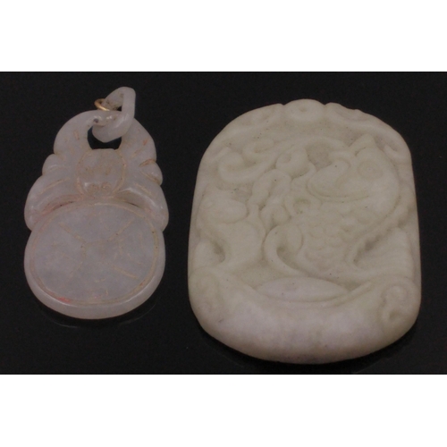 54 - Two carved jade pendants one 4cm long, the other, carved with fish is 5cm long#65