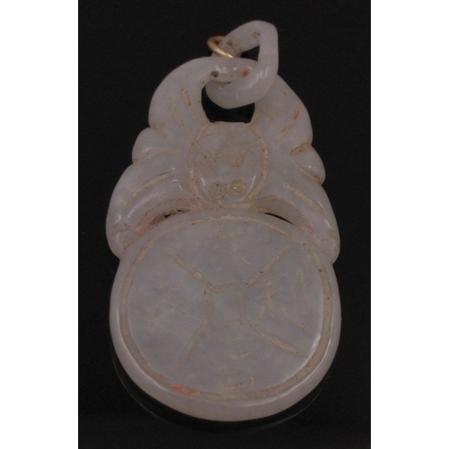 54 - Two carved jade pendants one 4cm long, the other, carved with fish is 5cm long#65