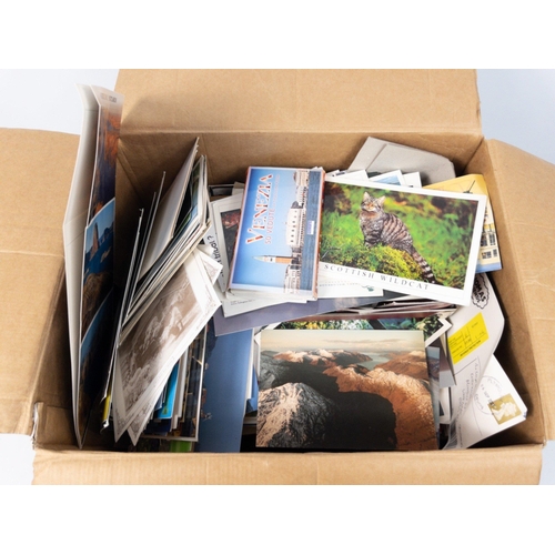 64 - A large box of modern age unsorted coloured postcards.#75