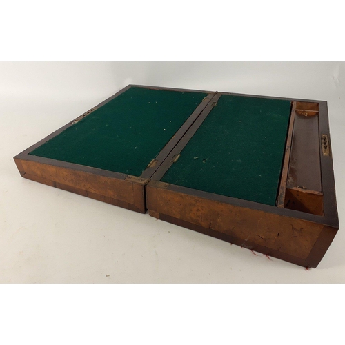 65 - An antique writing slope in need of some restoring there is some loss to the veneer and the lock whi... 