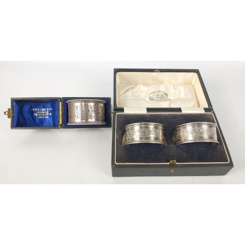 69 - A boxed pair of silver hallmarked napkin rings Newcastle 1915 weight 20.75g plus a further napkin ri... 