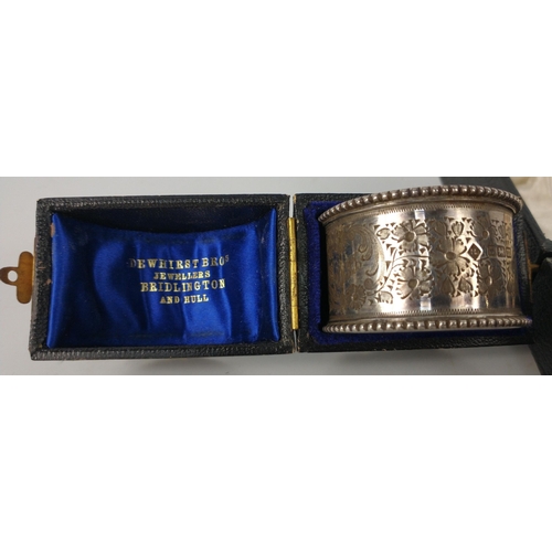 69 - A boxed pair of silver hallmarked napkin rings Newcastle 1915 weight 20.75g plus a further napkin ri... 