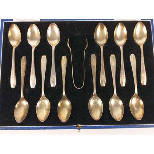 72 - A boxed set of 12 monogrammed silver teaspoons and pair of tongs, hallmarked Sheffield 1932, by Vine... 