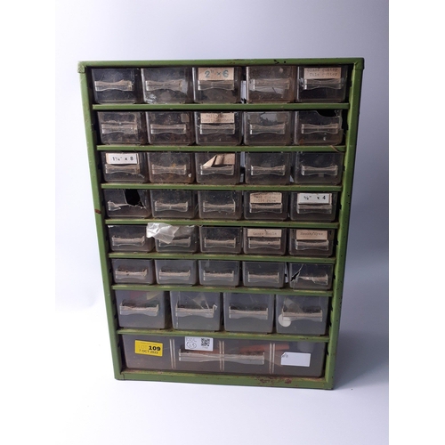 109 - A small 42cm x 31cm x 15cm metal framed set of drawers full of assorted SCREWS , CLIPS , HINGES , PI... 