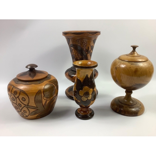 135 - A turned fruitwood urn approx 24cm tall and a selection of Haitian carved wood vessels to include a ... 