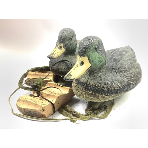 149 - Two resin decoy ducks suitable for a pond or garden feature approx 32cm long#134