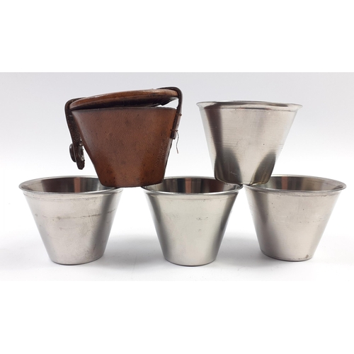 163 - An attractive Danish set of shot cups in a neat leather container 5cm dia and 5 cm tall#148