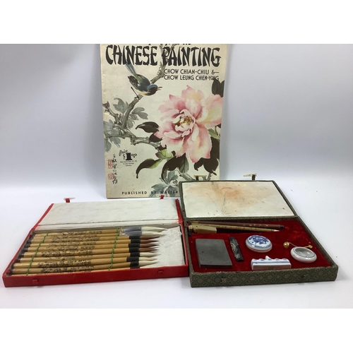 195 - Explore a new hobby with this lot consisting of a Chinese calligraphy set, a set of Chinese paint br... 