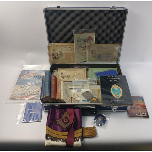 210 - A metal storage case with Masonic apron, Girl guide badges, a stamp album, some cigarette card album... 