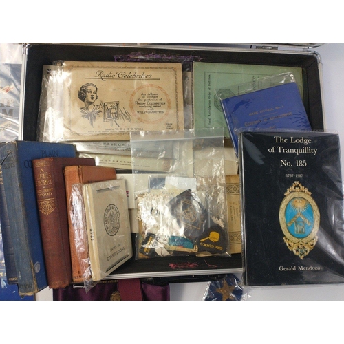 210 - A metal storage case with Masonic apron, Girl guide badges, a stamp album, some cigarette card album... 