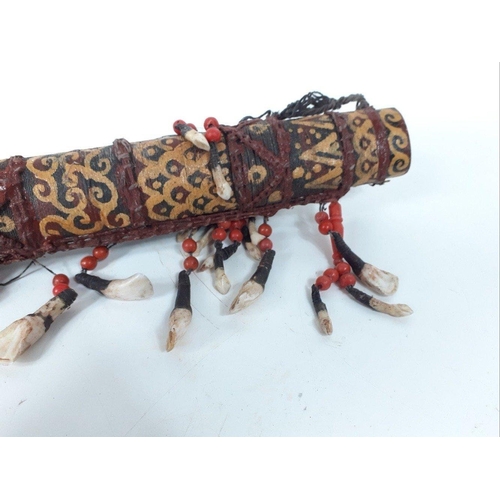 250 - Highly decorated Indonesian / Asian Kris style sword in elaborate sheath decorated with animal teeth... 