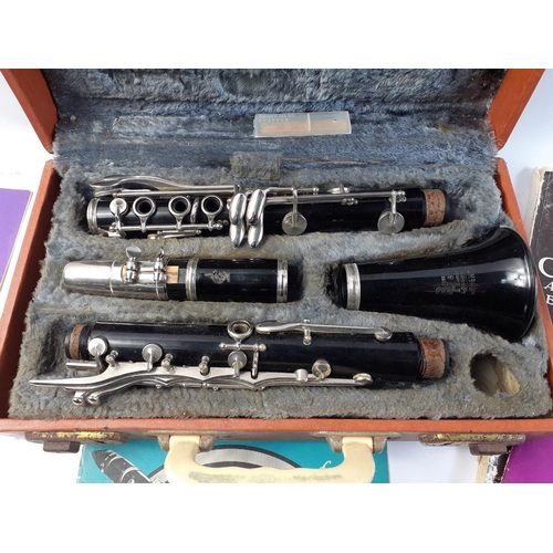 265 - Boosey & Hawkes Regent Clarinet in case with a selection of music.#244