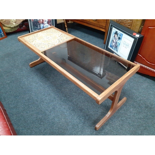 308 - A 1970s coffee table G-Plan one third tiled and two thirds smoked glass. 120 x 49 x 45 cm
These G-Pl... 