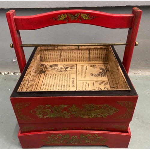 325 - An ORIENTAL HIGHLY decorative red, gold and black painted and lacquered layer with carry handle mock... 