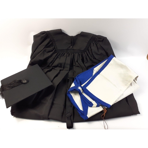 335 - A box containing quality graduation gown (length approx 115cm), mortar board and academic hood.  The... 