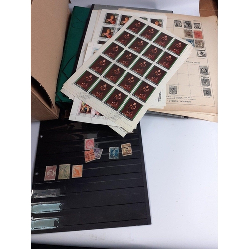 376 - A box containing a large quantity of UK and foreign stamps.  Mainly on disbound album pages, some en... 