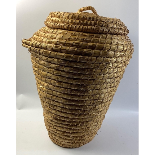 390 - An 'Alibaba' style wicker basket standing approx 60cm tall#367