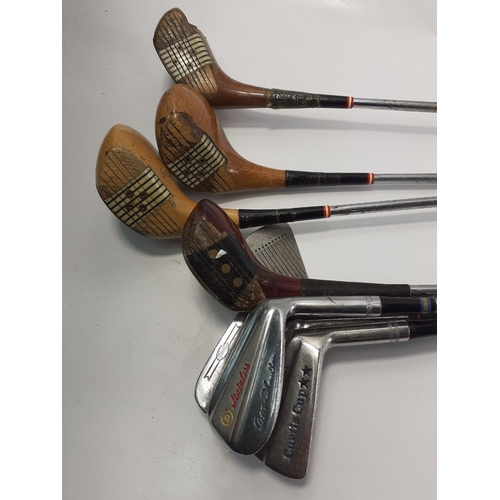 410 - A collection of mixed gold clubs to include 5 irons and 4 woods#387