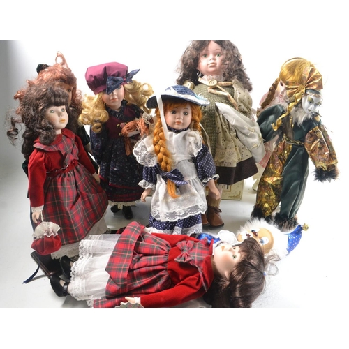 43 - A collection of dolls to include handpainted porcelain dolls.#39