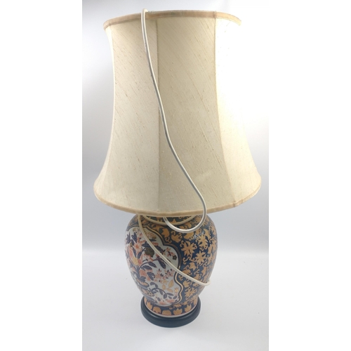 92 - A large Imari style table lamp standing 66cm tall on a wooden base with cream raw silk-style shade#8... 