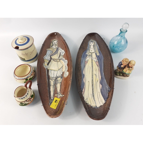 96 - A mixed ceramic lot of decorative items to include two wall mounted plaques with rather attractive f... 