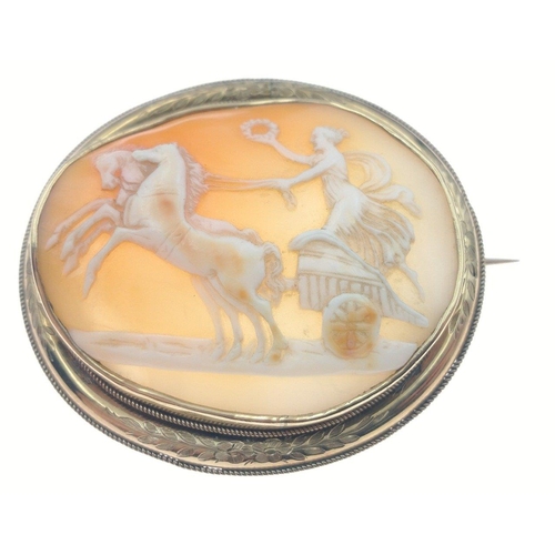 105 - An attractive pinchbeck translucent cameo brooch with a design of a female charioteer, 6cm length, b... 