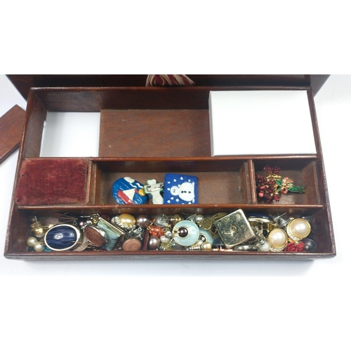 109 - A VINTAGE mahogany wooden jewellery box complete with key and contents, mainly strings of beads and ... 