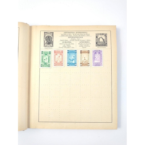 157 - A vintage 23rd edition STRAND STAMP ALBUM dated 1907 with several stamps contained inside from count... 