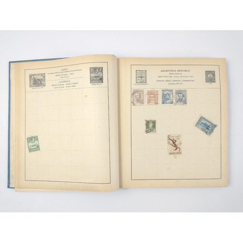 157 - A vintage 23rd edition STRAND STAMP ALBUM dated 1907 with several stamps contained inside from count... 