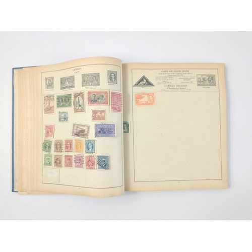 157 - A vintage 23rd edition STRAND STAMP ALBUM dated 1907 with several stamps contained inside from count... 