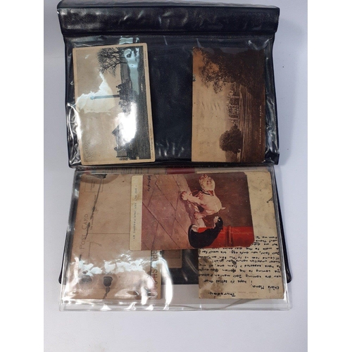 158 - A small folder containing a small amount of postcards. Around 10 postcards mainly cartoons in worn c... 