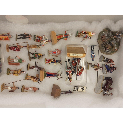 187 - A collection of diecast and plastic painted military army figures from various historical eras. Many... 